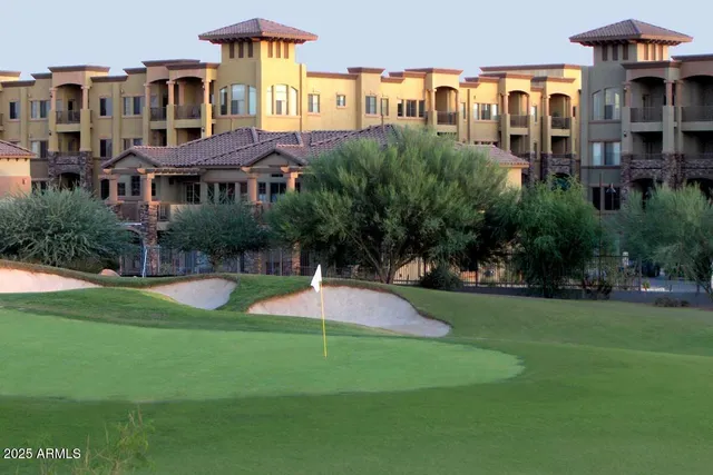 a front view of a building with garden