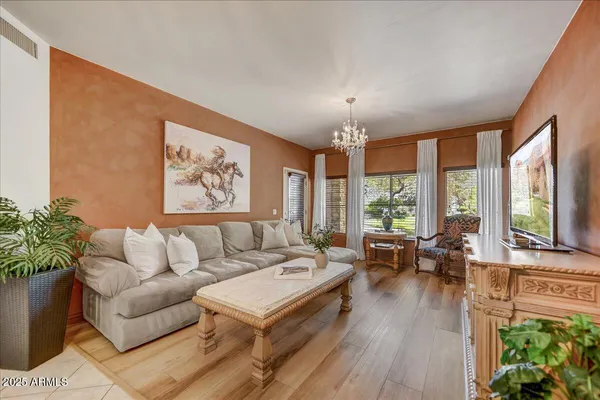 a living room with furniture and a large window