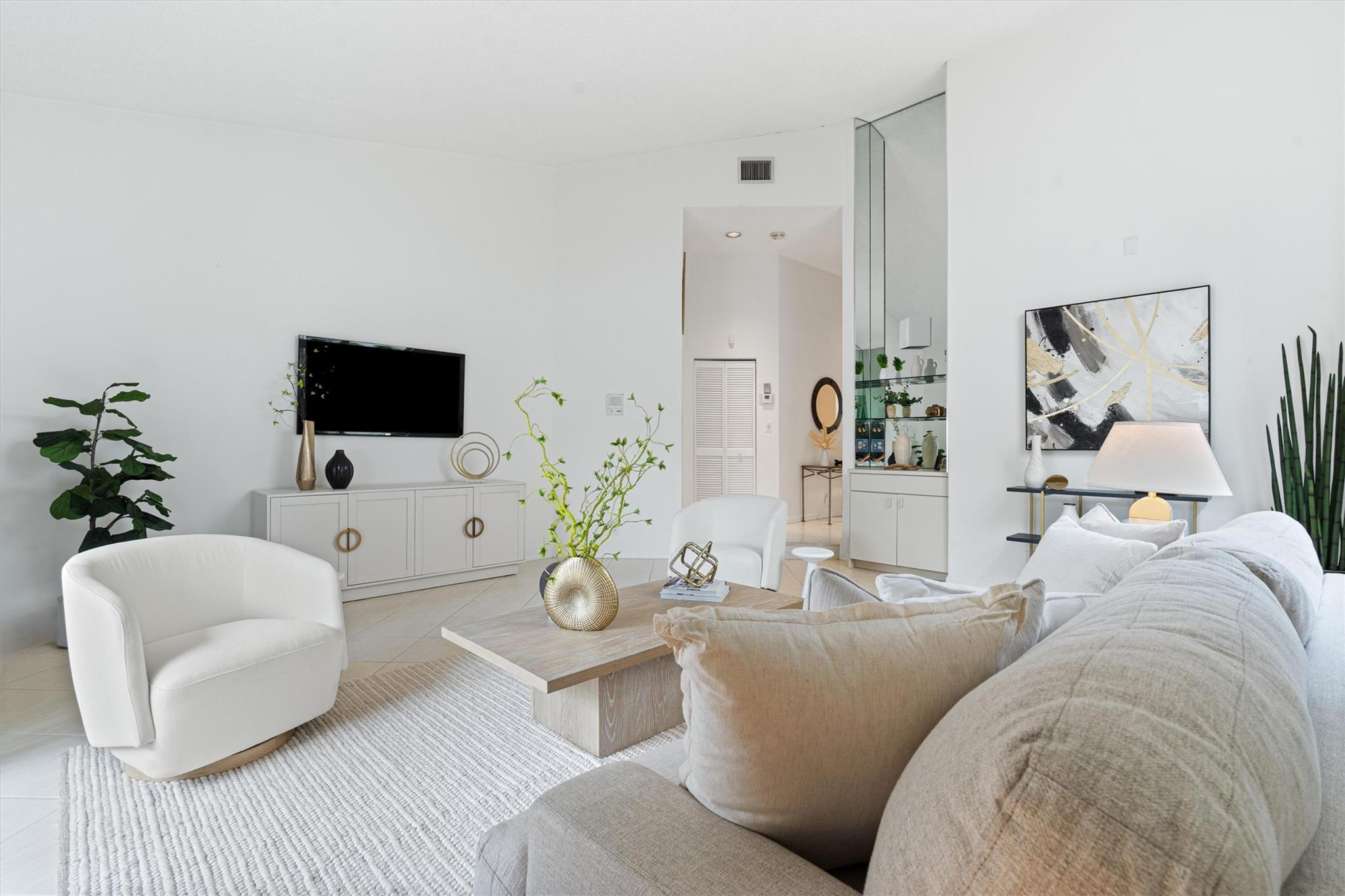 23012 Via Stel Boca Raton, FL 33433 - Photo 3 of 24 a living room with furniture and a flat screen tv