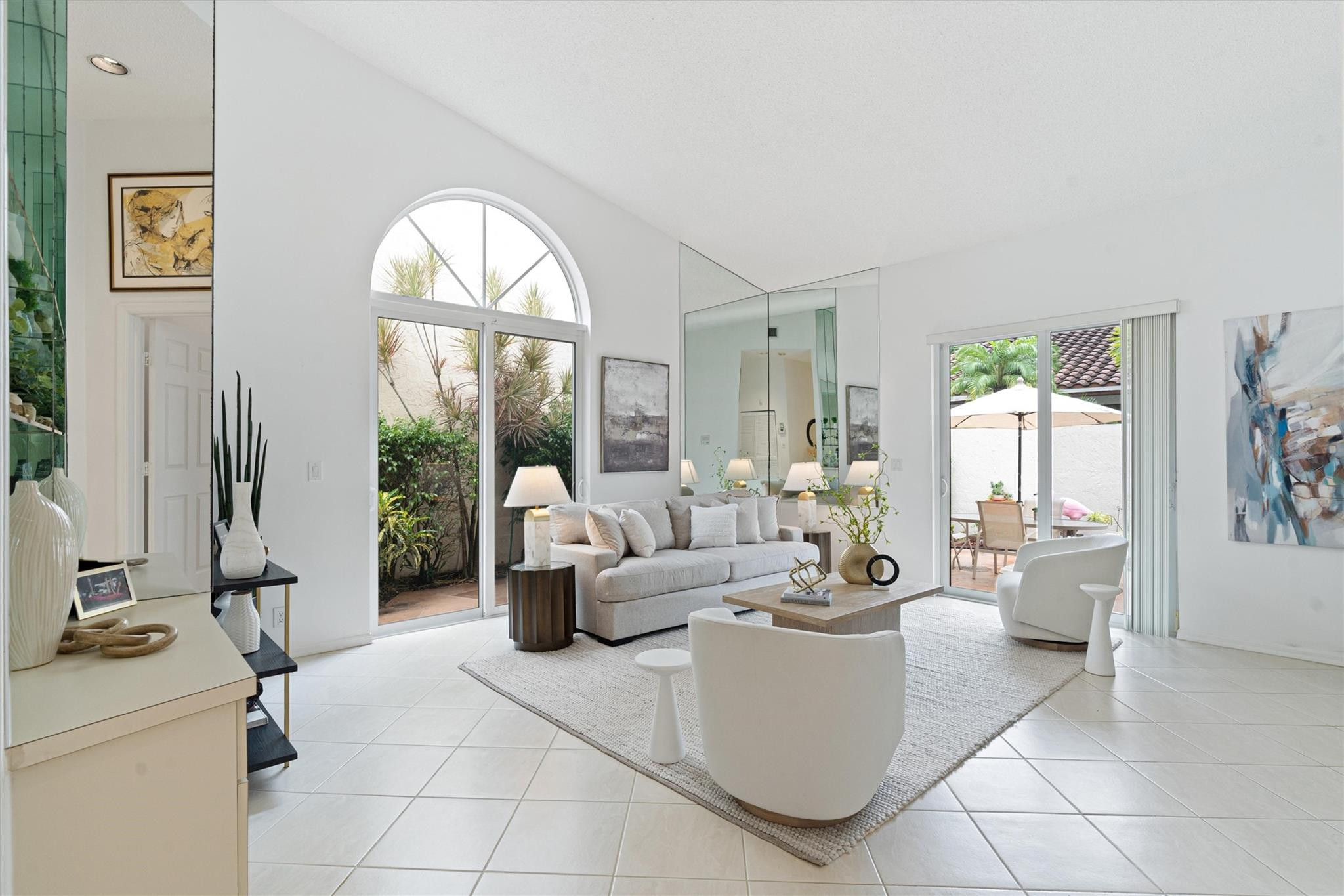 23012 Via Stel Boca Raton, FL 33433 - Photo 7 of 24 a living room with furniture and a large window