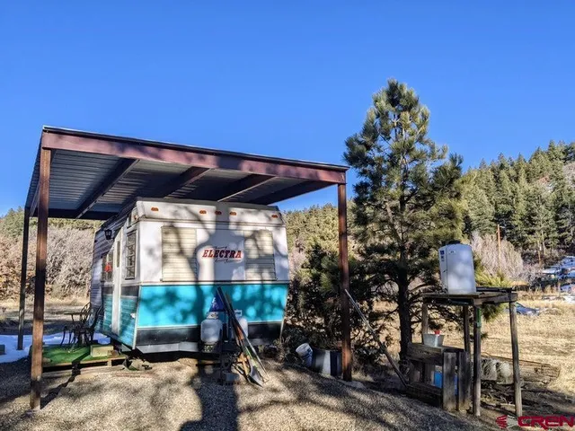 a view of a chairs and table in a patio
