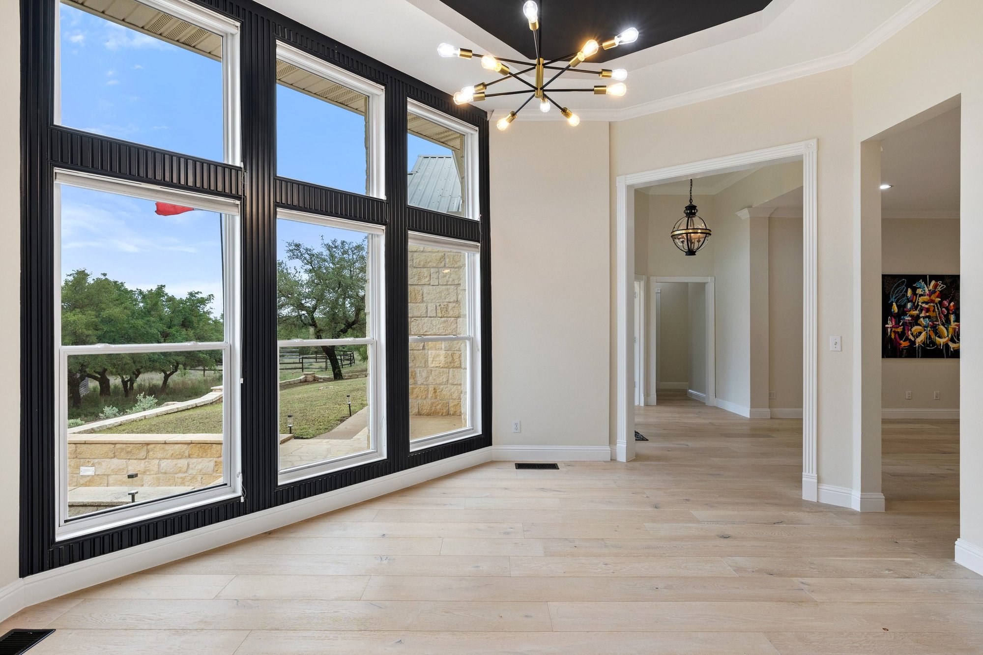4915 Canyon Ranch Trail Spicewood, TX 78669 - Photo 20 of 40 Custom wood trim highlights the wall of windows.