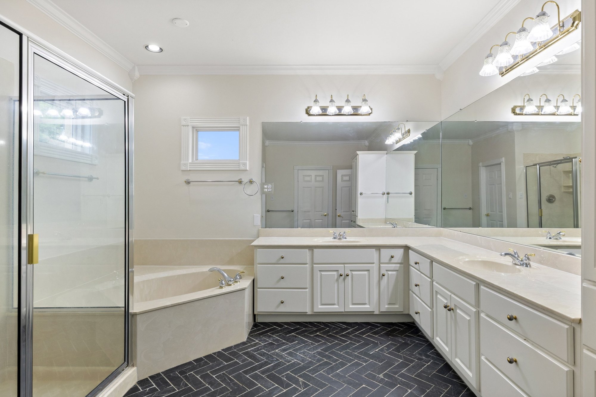 4915 Canyon Ranch Trail Spicewood, TX 78669 - Photo 24 of 40 Primary bath with gorgeous herringbone tile flooring and dual vanity.
