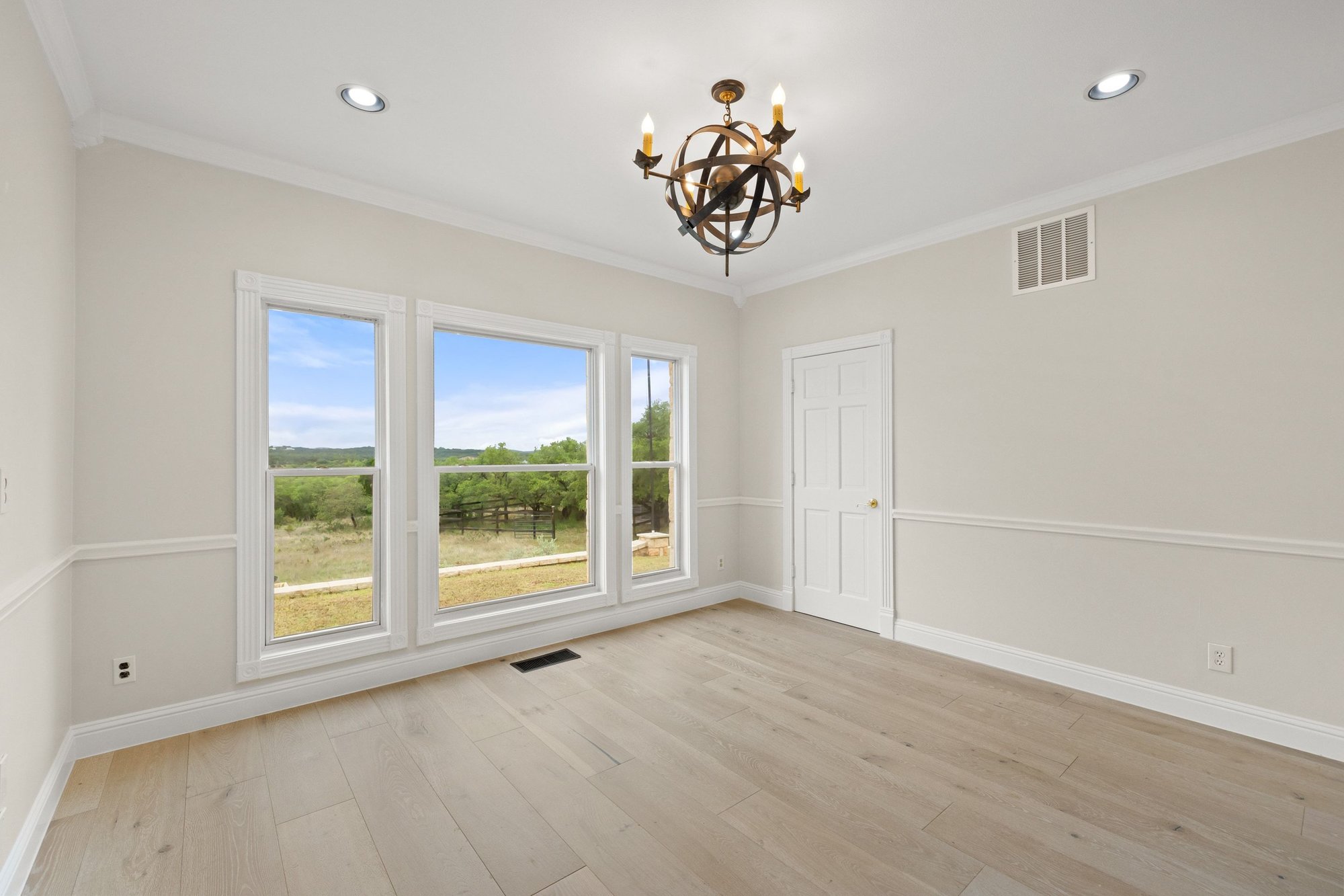 4915 Canyon Ranch Trail Spicewood, TX 78669 - Photo 25 of 40 Bedroom 2 with amazing view of the property - this bedroom does have French doors making it a great home office.
