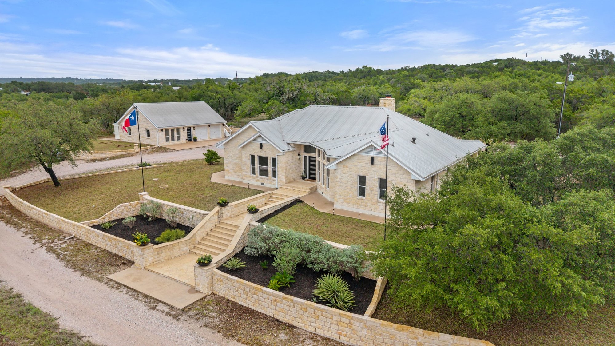 4915 Canyon Ranch Trail Spicewood, TX 78669 - Photo 3 of 40 The left structure with the garage is the Casita with a full bed and bath.