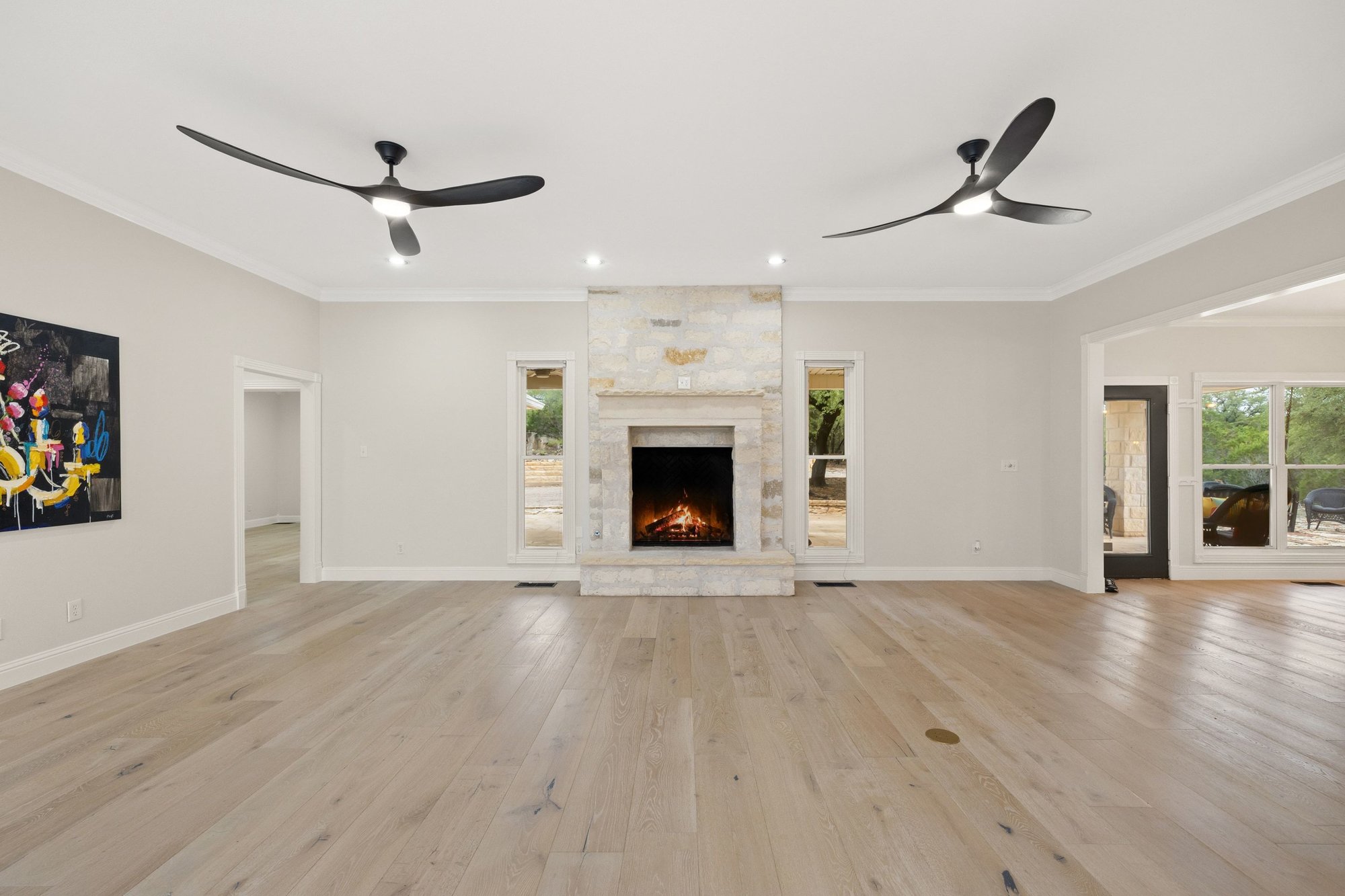 4915 Canyon Ranch Trail Spicewood, TX 78669 - Photo 6 of 40 Note this HUGE space, two ceiling fans, and oversized firebox with floor to ceiling stone.