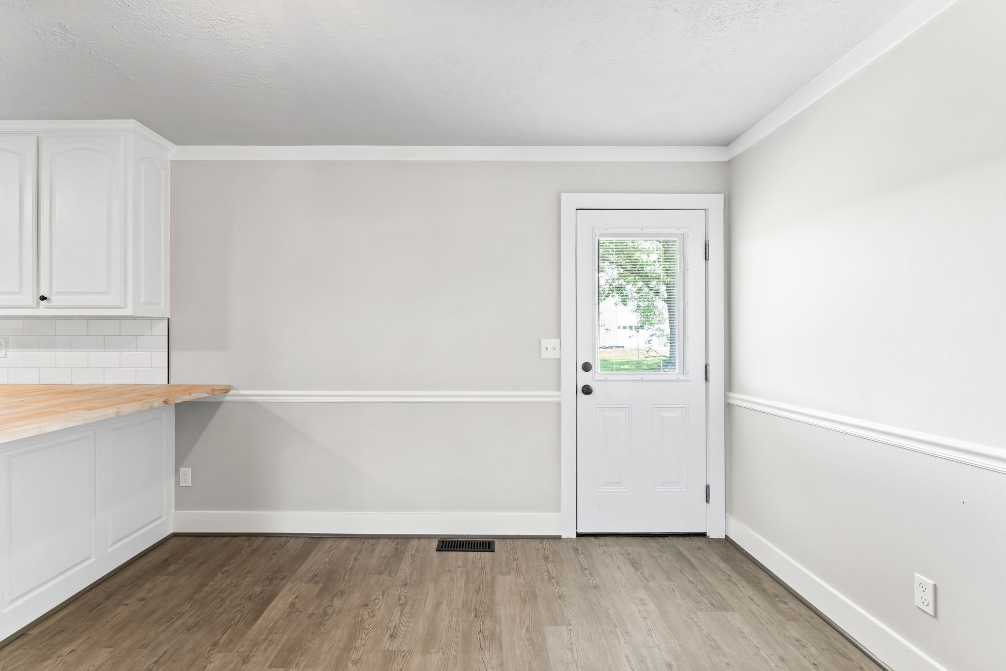 1950 Norton Road Lawrenceburg, TN 38464 - Photo 19 of 43 a view of an empty room with wooden floor and a window