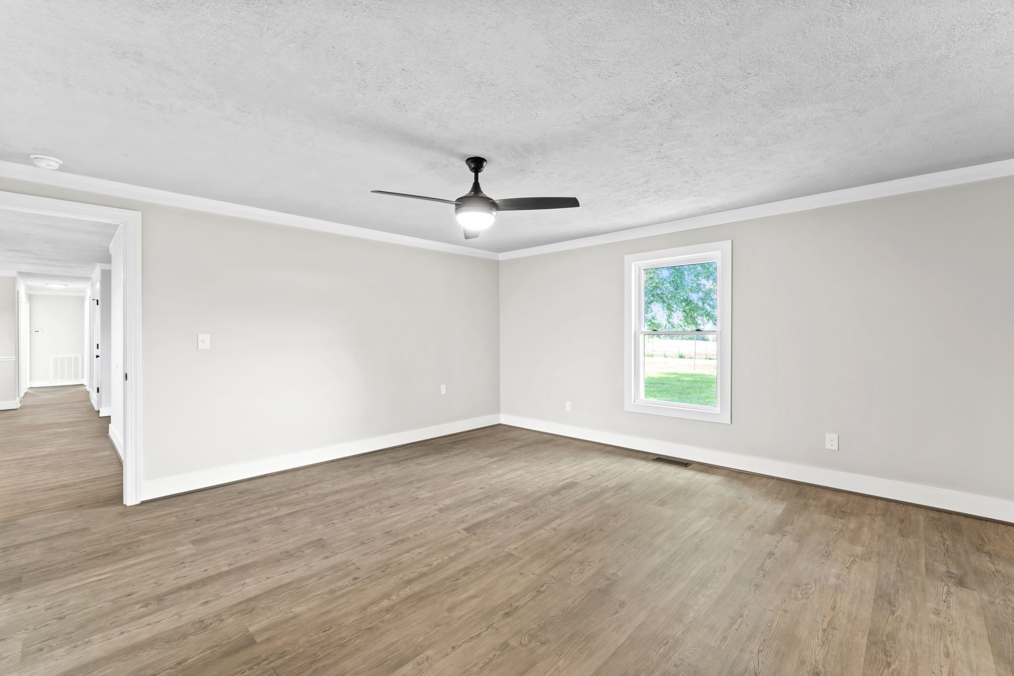 1950 Norton Road Lawrenceburg, TN 38464 - Photo 25 of 43 a view of an empty room with wooden floor and a window