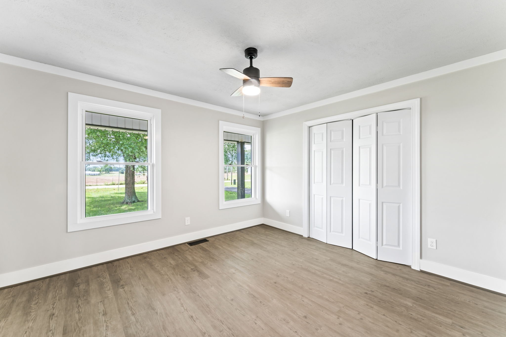 1950 Norton Road Lawrenceburg, TN 38464 - Photo 28 of 43 a view of an empty room with wooden floor and a window