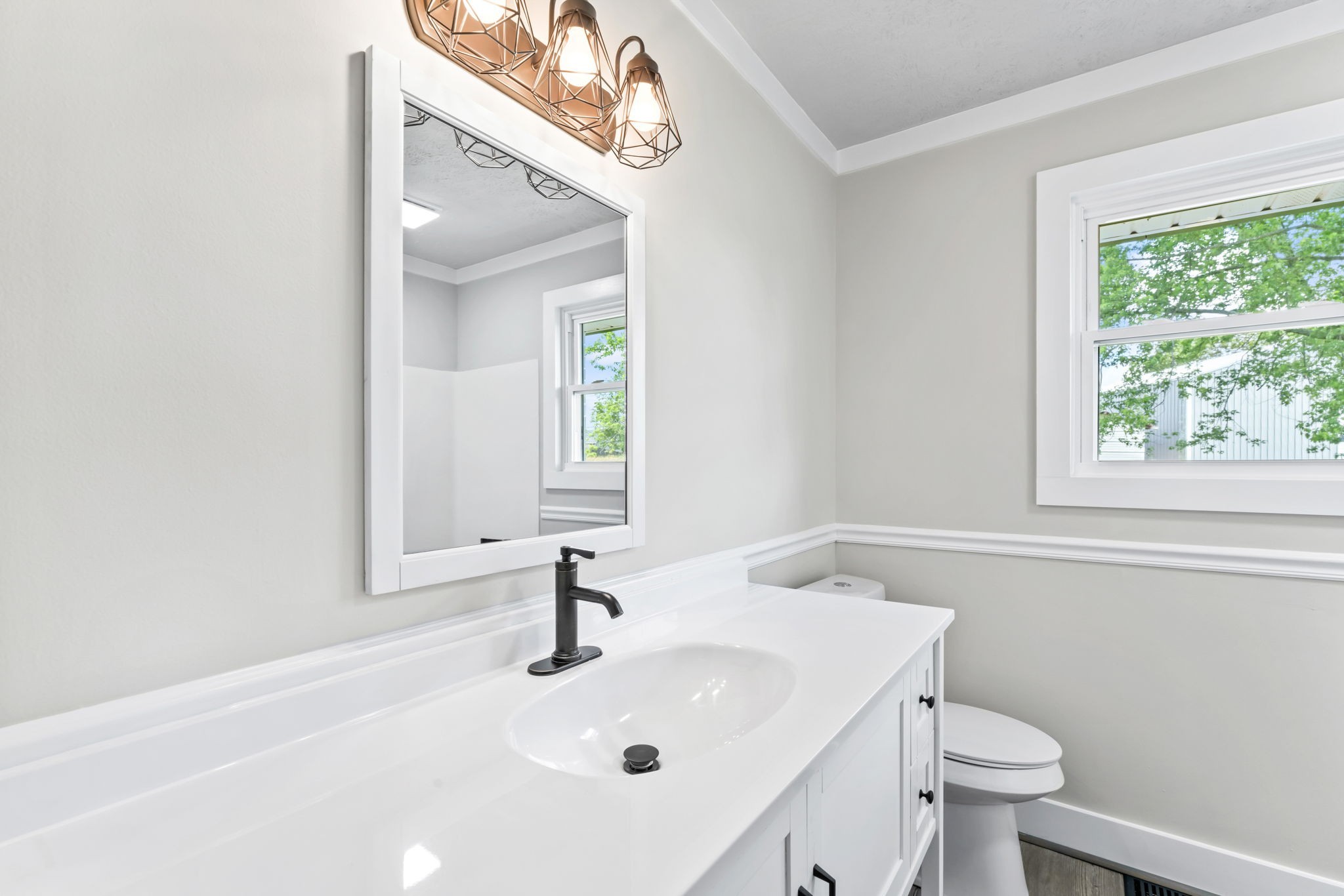 1950 Norton Road Lawrenceburg, TN 38464 - Photo 30 of 43 a bathroom with a sink a toilet and a mirror