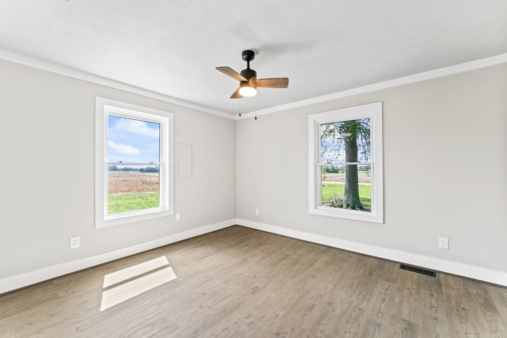 1950 Norton Road Lawrenceburg, TN 38464 - Photo 32 of 43 an empty room with windows and a ceiling fan