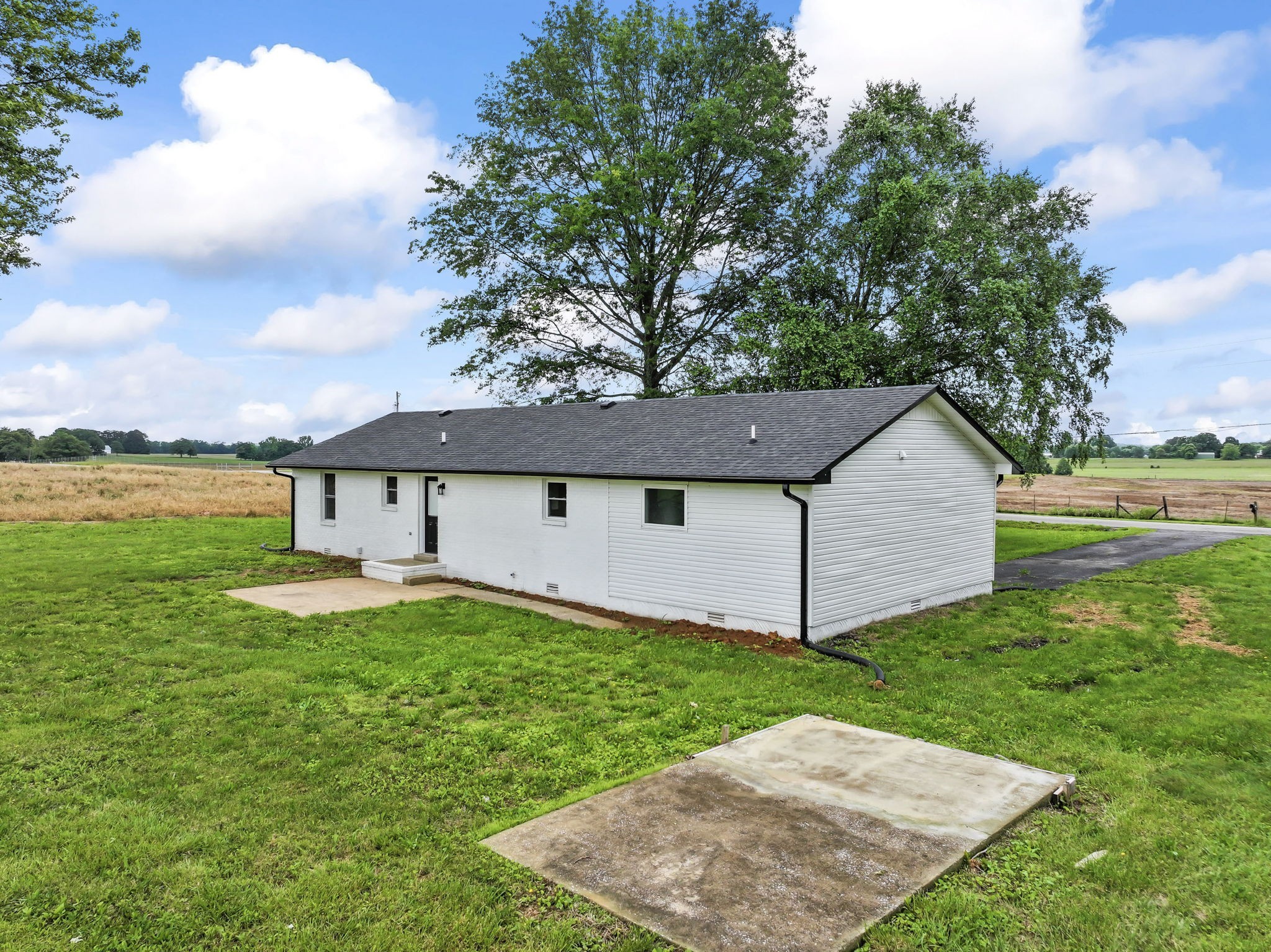 1950 Norton Road Lawrenceburg, TN 38464 - Photo 40 of 43 a view of a house with a yard and a large tree