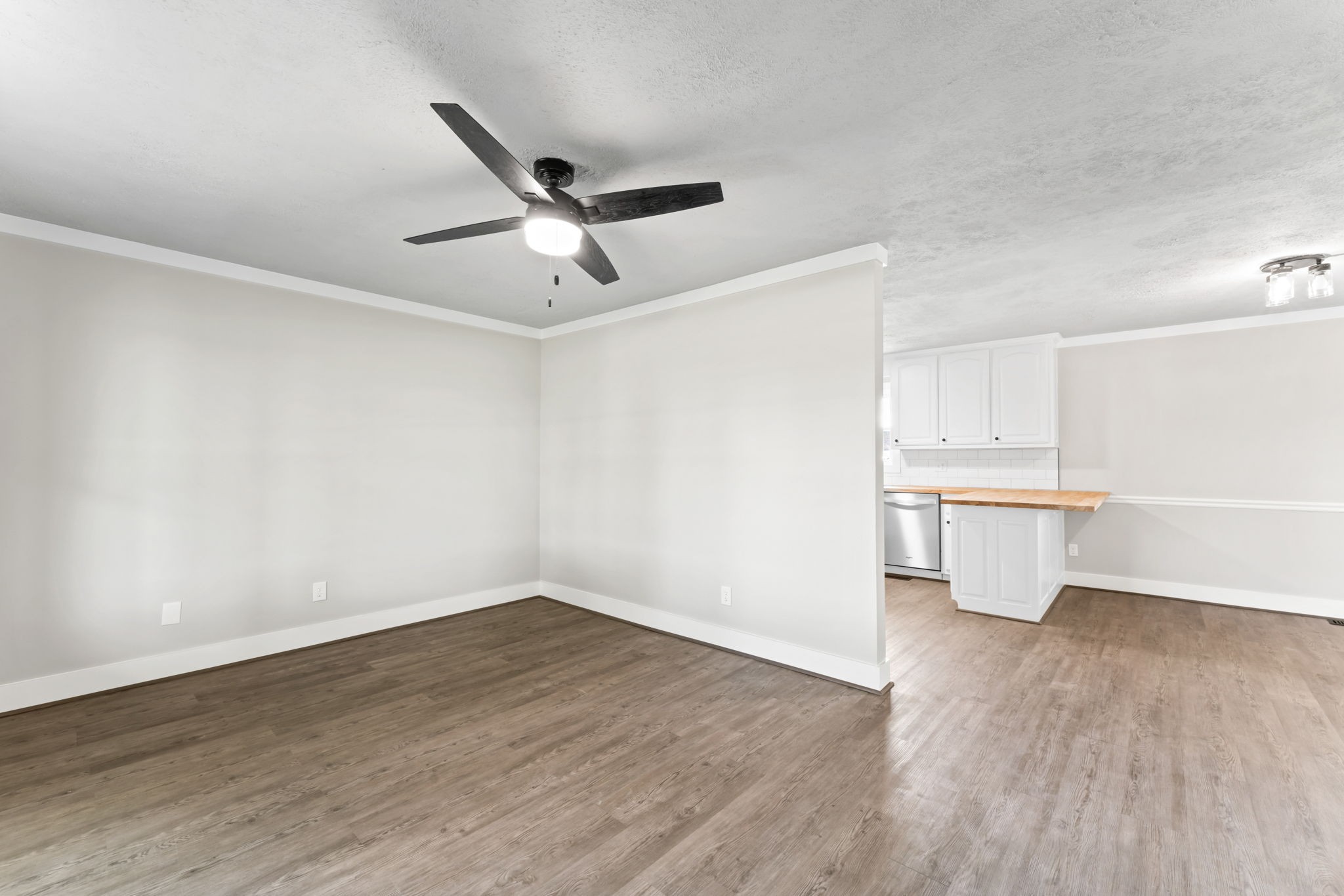 1950 Norton Road Lawrenceburg, TN 38464 - Photo 5 of 43 a view of a room with wooden floor and a ceiling fan