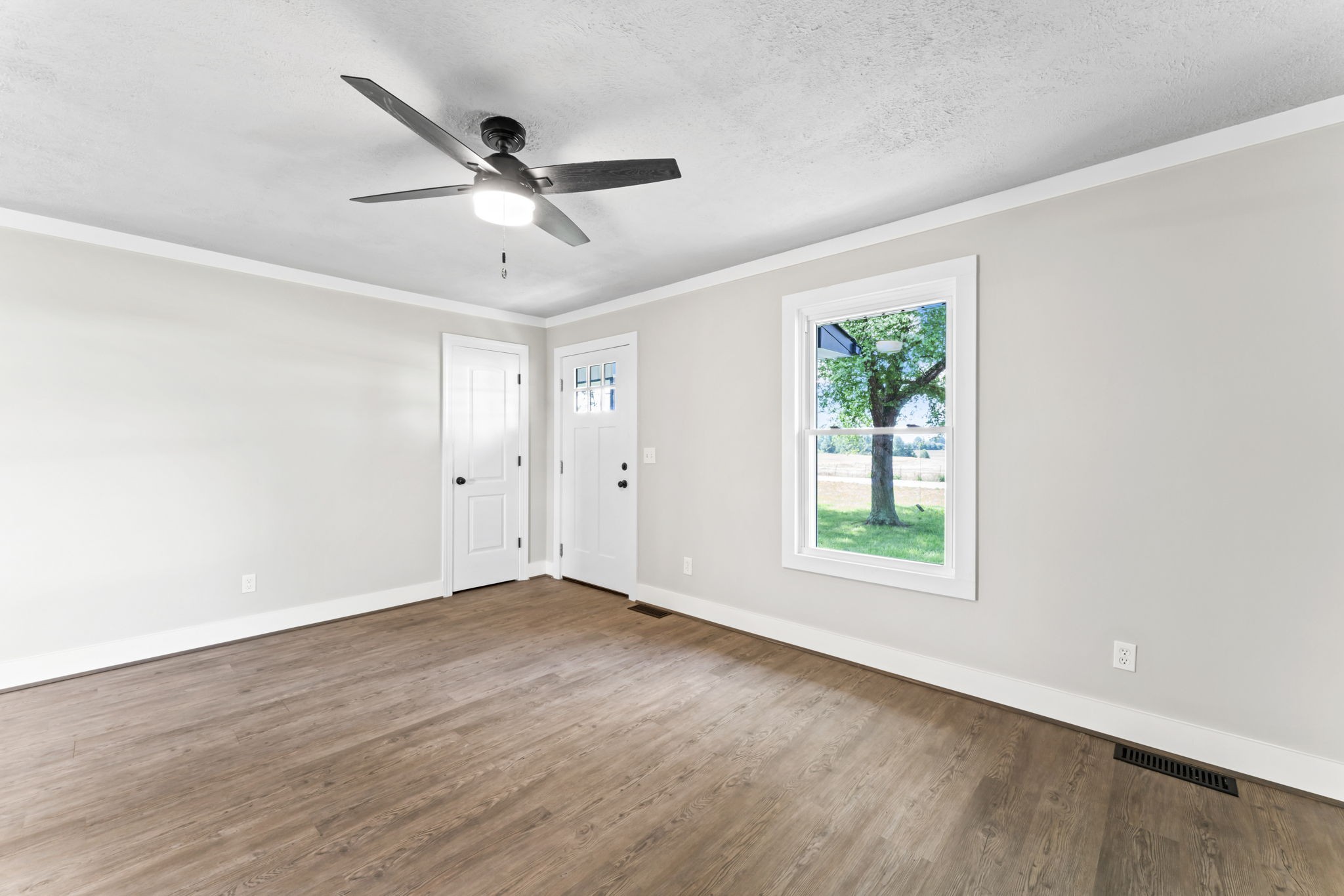 1950 Norton Road Lawrenceburg, TN 38464 - Photo 9 of 43 wooden floor in an empty room with a window
