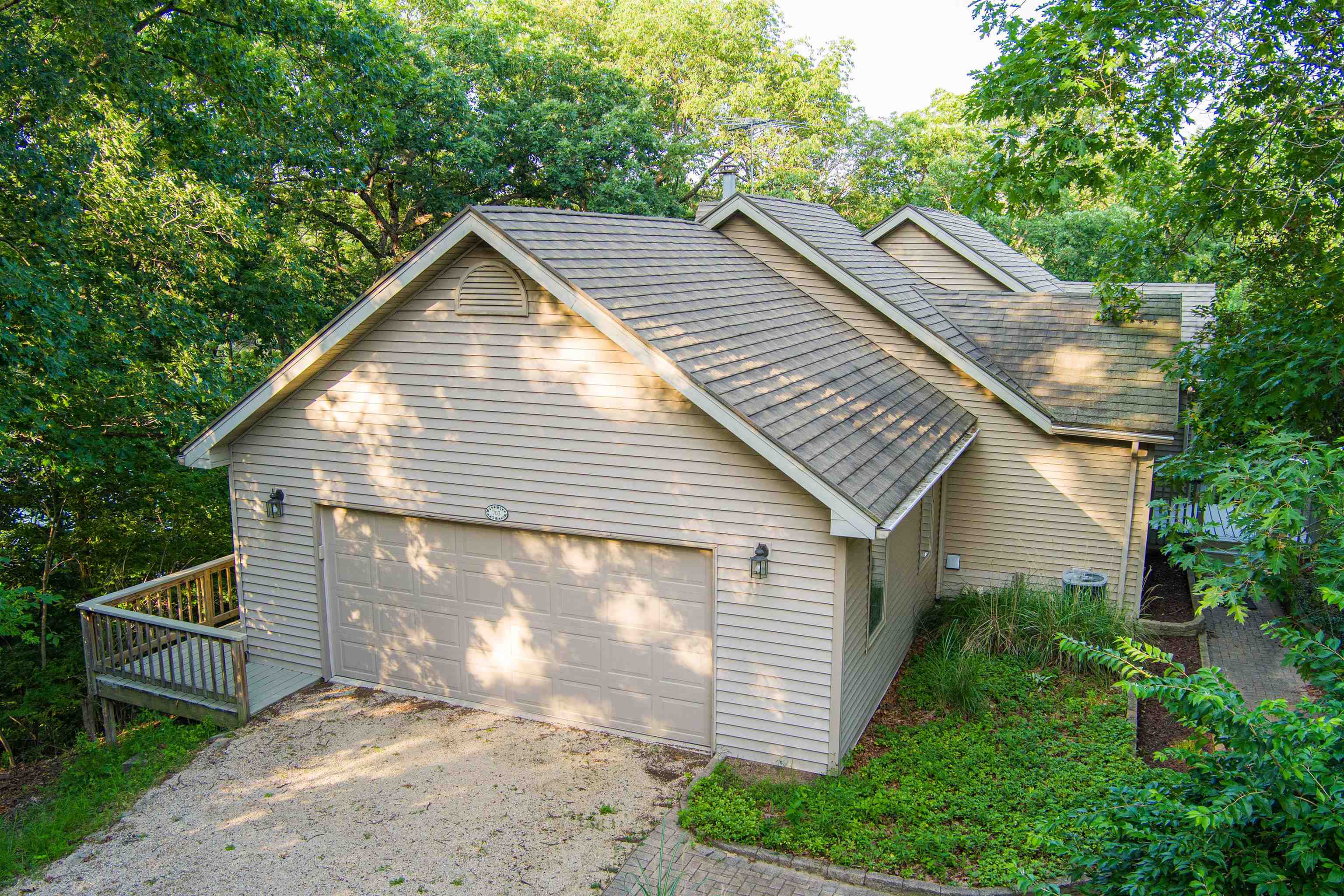 a view of house with backyard and garden
