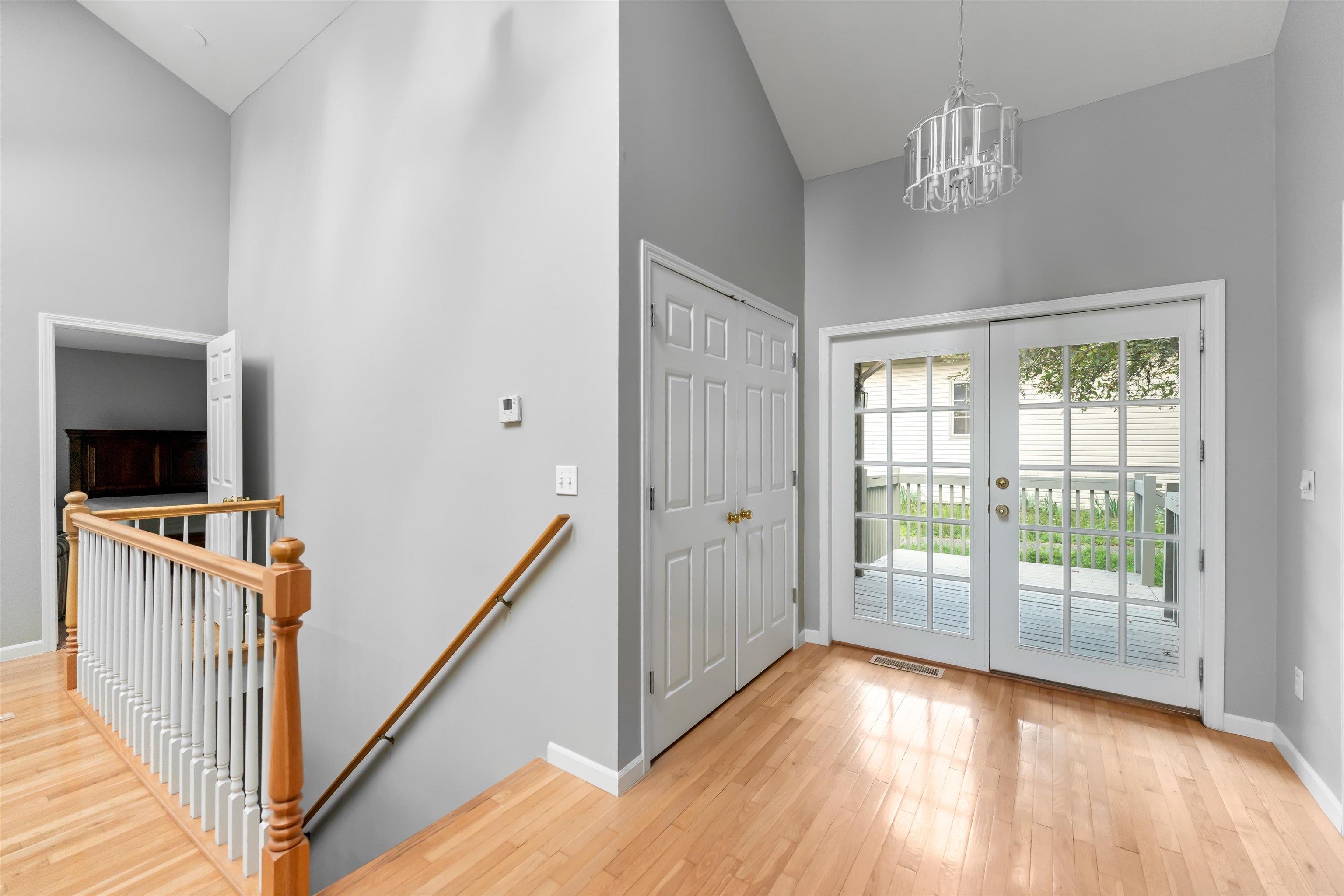 703 Rock Court Dixon, IL 61021 - Photo 11 of 42 a view of a hallway with wooden floor and stairs
