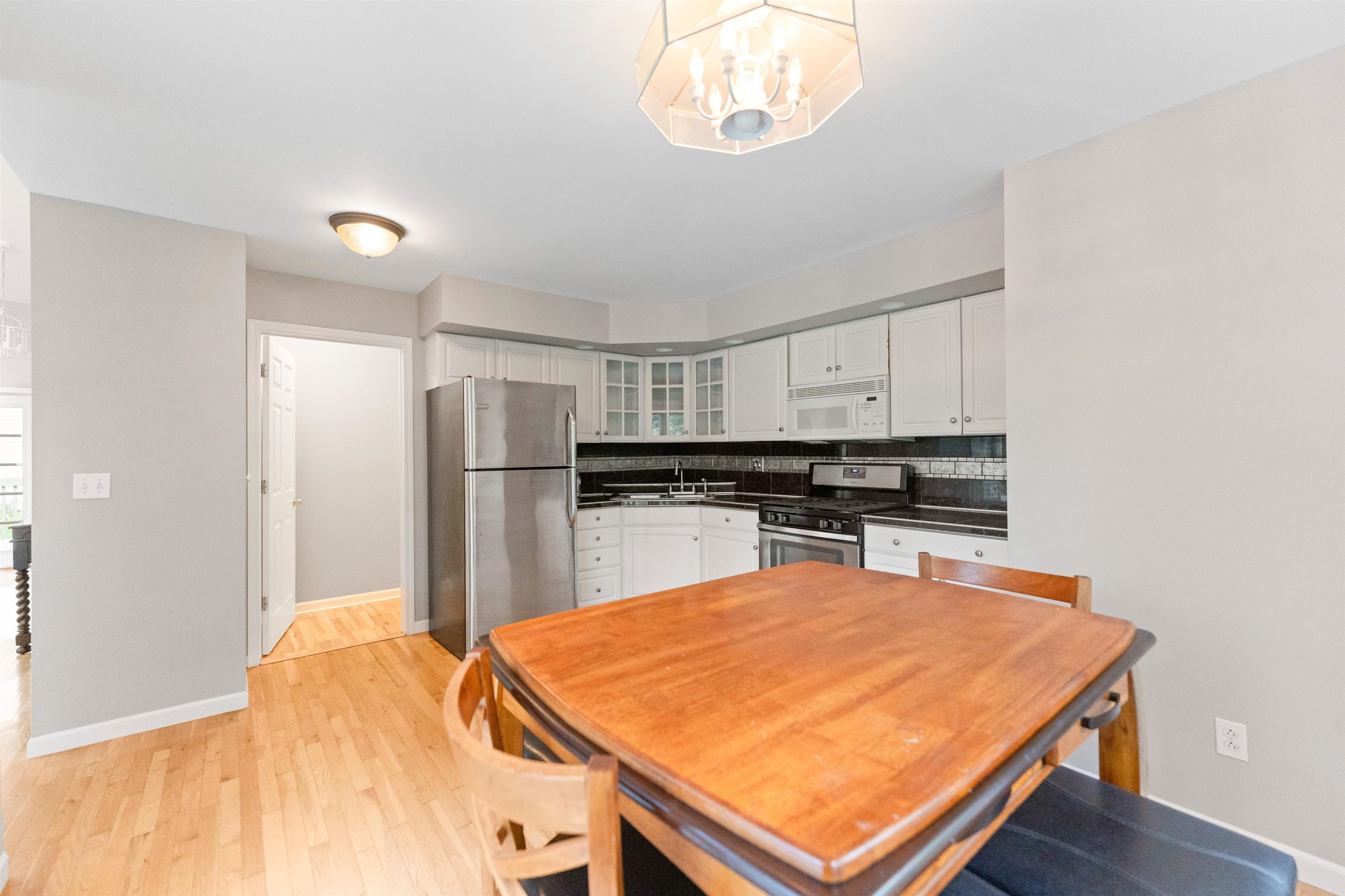 703 Rock Court Dixon, IL 61021 - Photo 14 of 42 a kitchen with stainless steel appliances a table and chairs