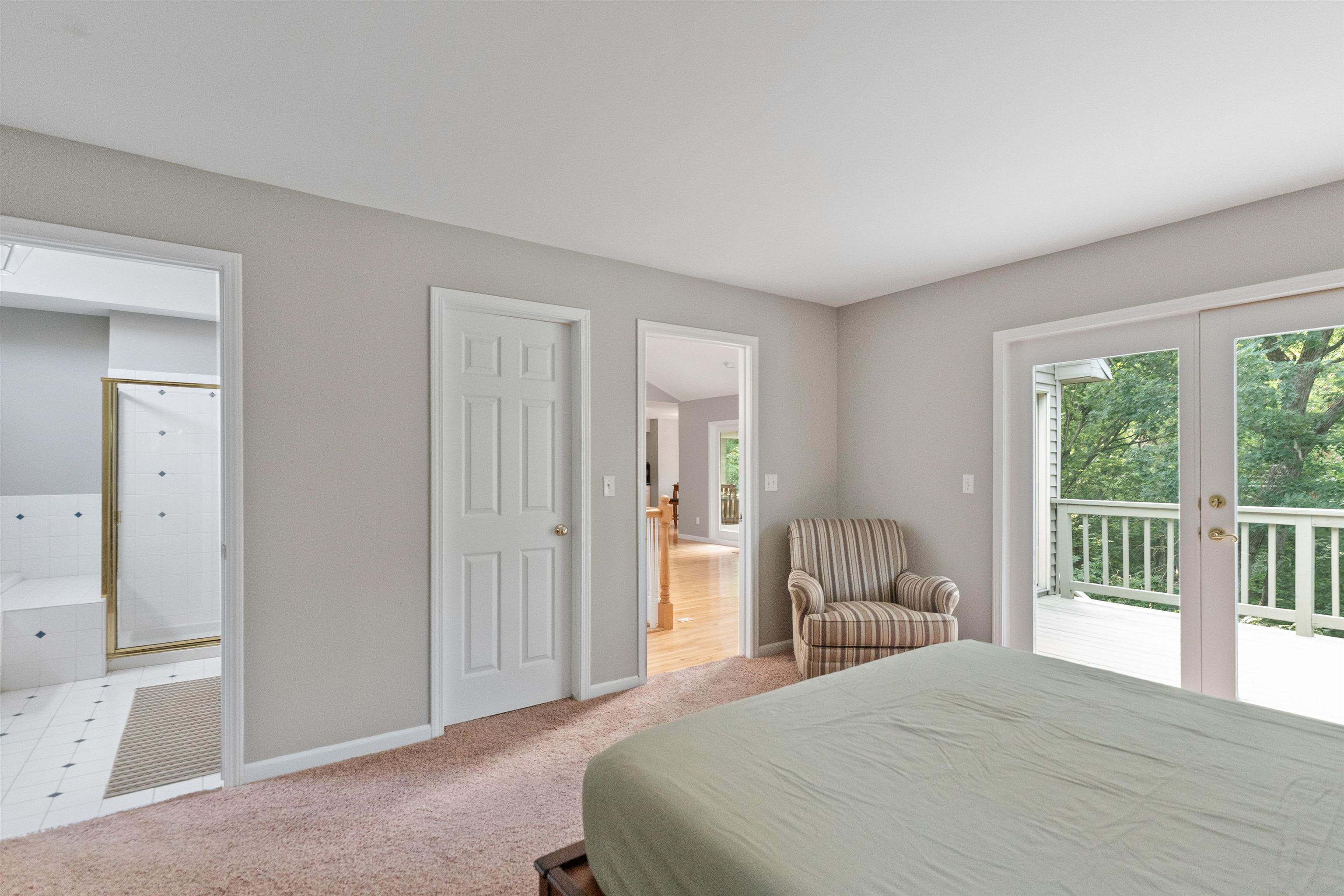703 Rock Court Dixon, IL 61021 - Photo 17 of 42 a bedroom with a bed and glass door