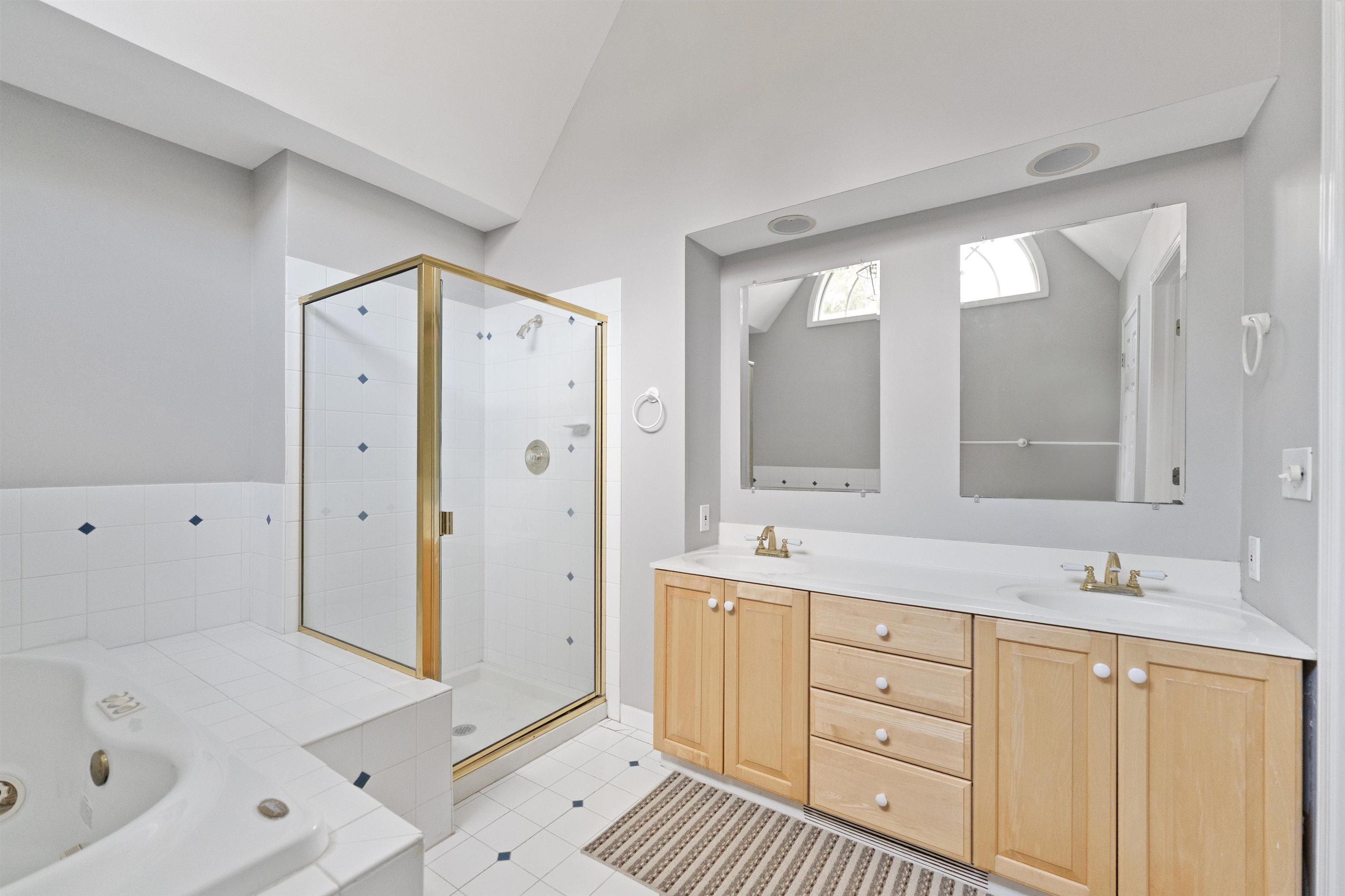 703 Rock Court Dixon, IL 61021 - Photo 19 of 42 a spacious bathroom with a double vanity sink mirror and double