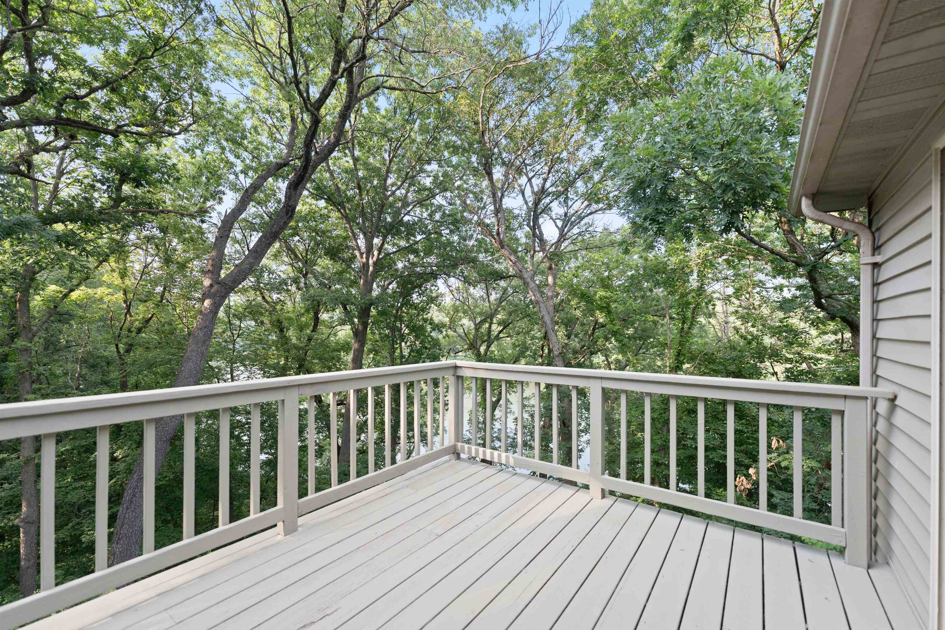 703 Rock Court Dixon, IL 61021 - Photo 22 of 42 a balcony with wooden floor and fence