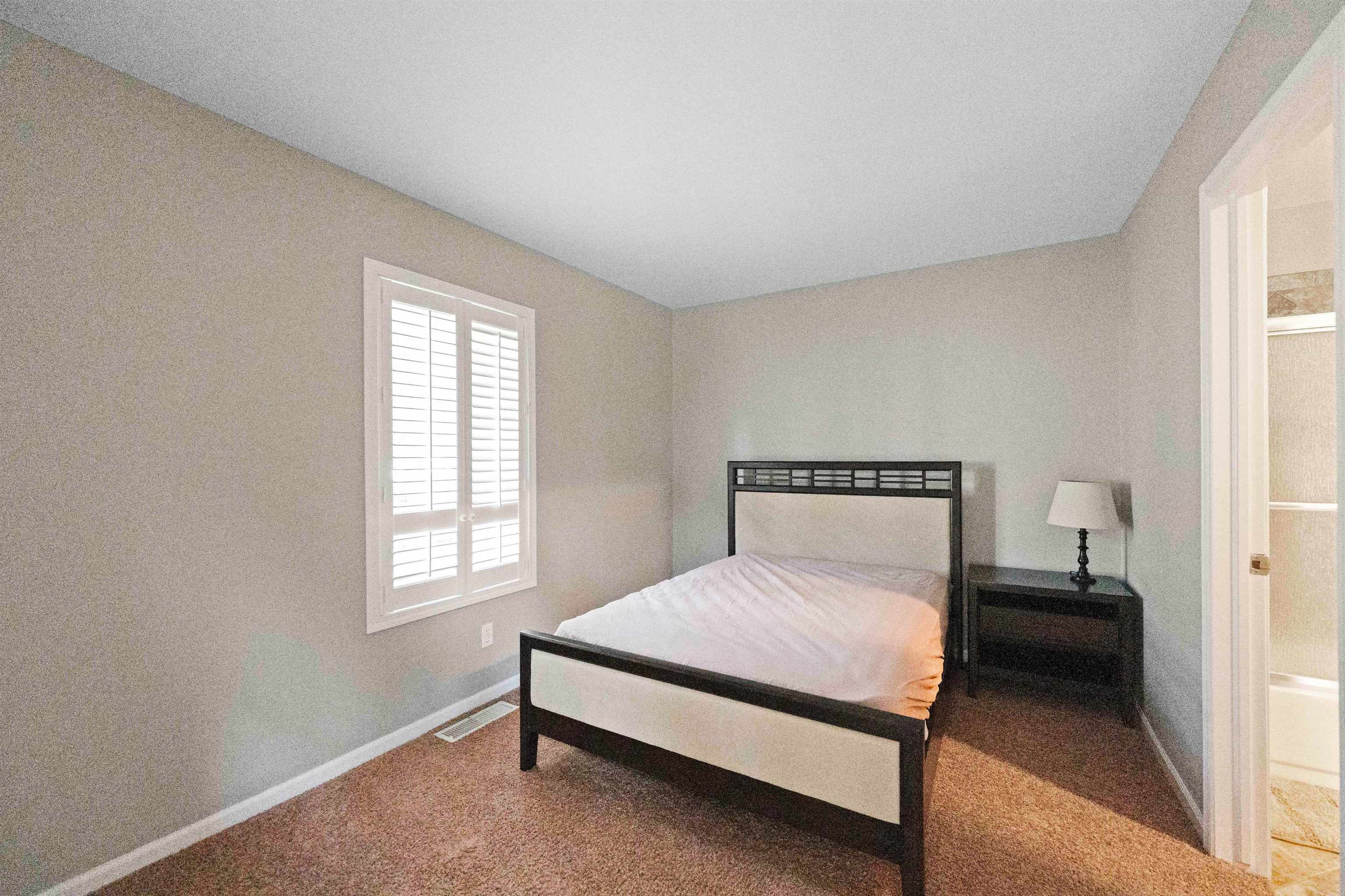 703 Rock Court Dixon, IL 61021 - Photo 23 of 42 a bedroom with a bed and a window