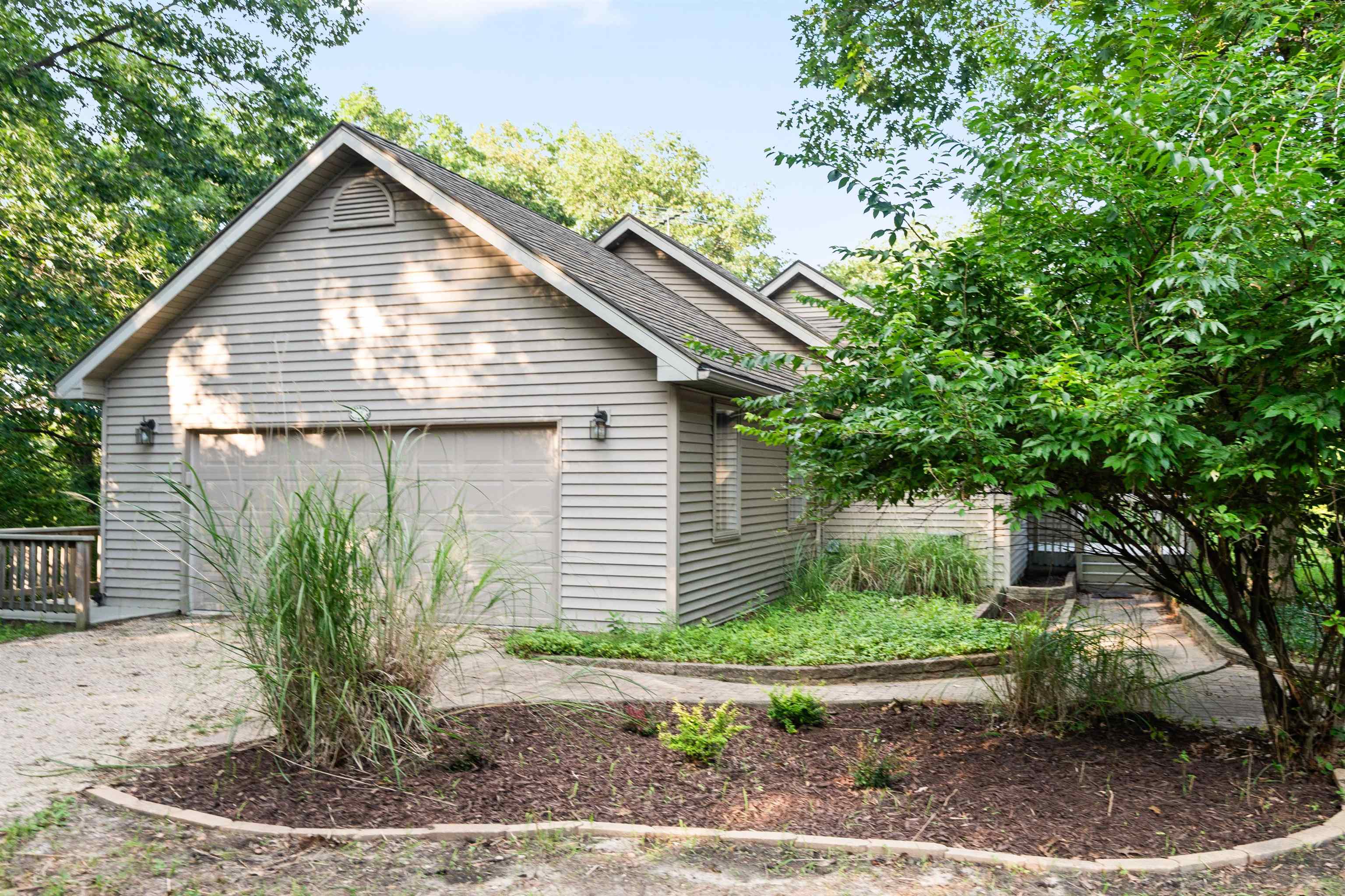 703 Rock Court Dixon, IL 61021 - Photo 3 of 42 a front view of a house with garden
