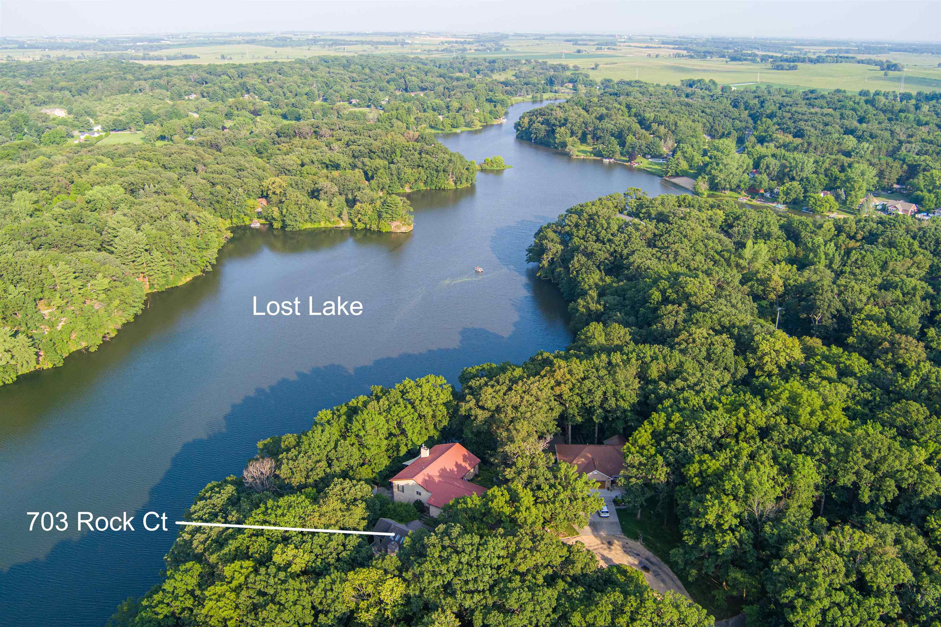 703 Rock Court Dixon, IL 61021 - Photo 5 of 42 an aerial view of lake and residential houses with outdoor space