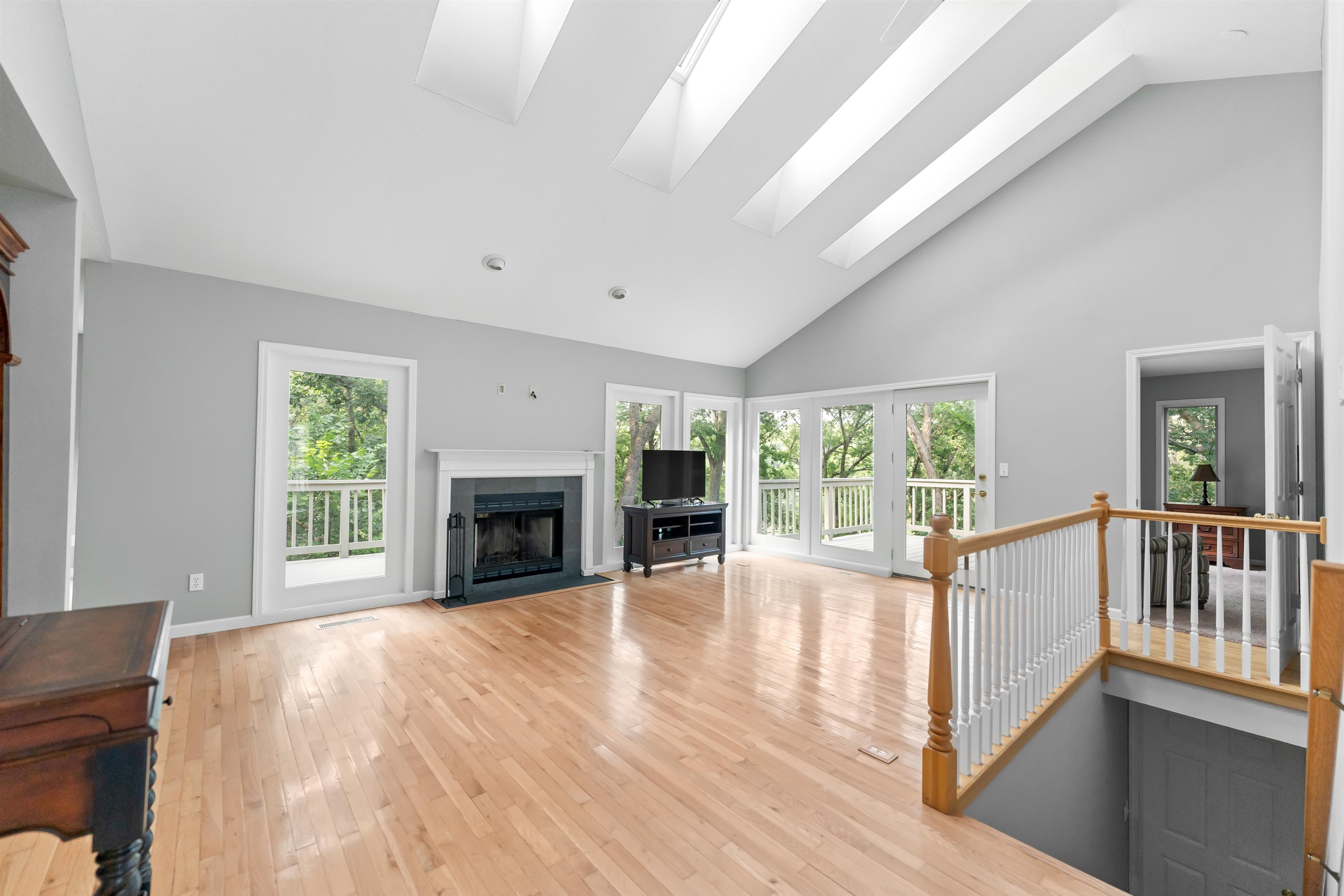 703 Rock Court Dixon, IL 61021 - Photo 8 of 42 a view of an empty room with large windows and a fireplace