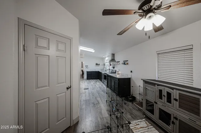 a view of living room with wooden floor