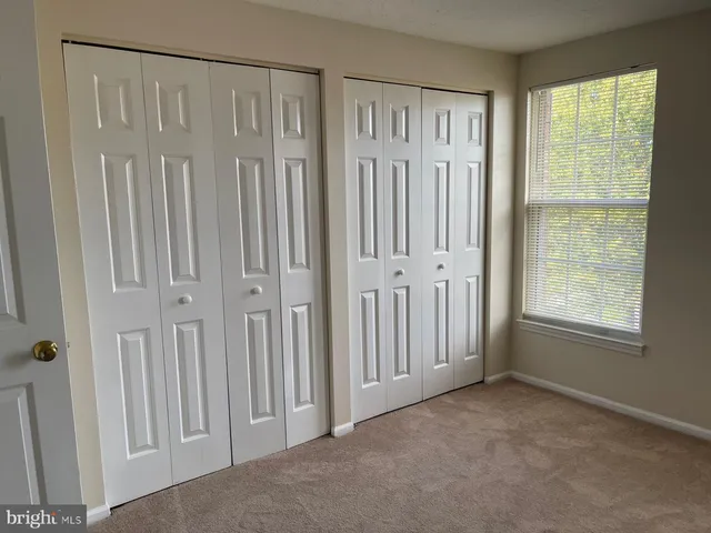 a bathroom with a sink shower and a mirror