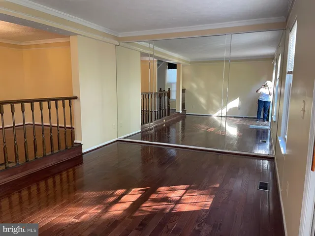 a view of entryway with wooden floor