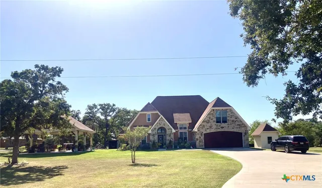 a view of house with outdoor space and tree s