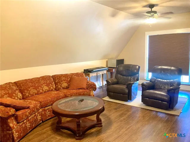 a living room with furniture and a couch