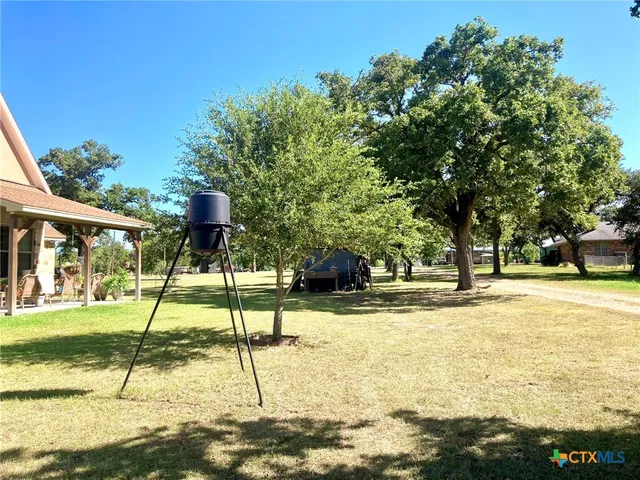 a view of a swimming pool with a house in the background