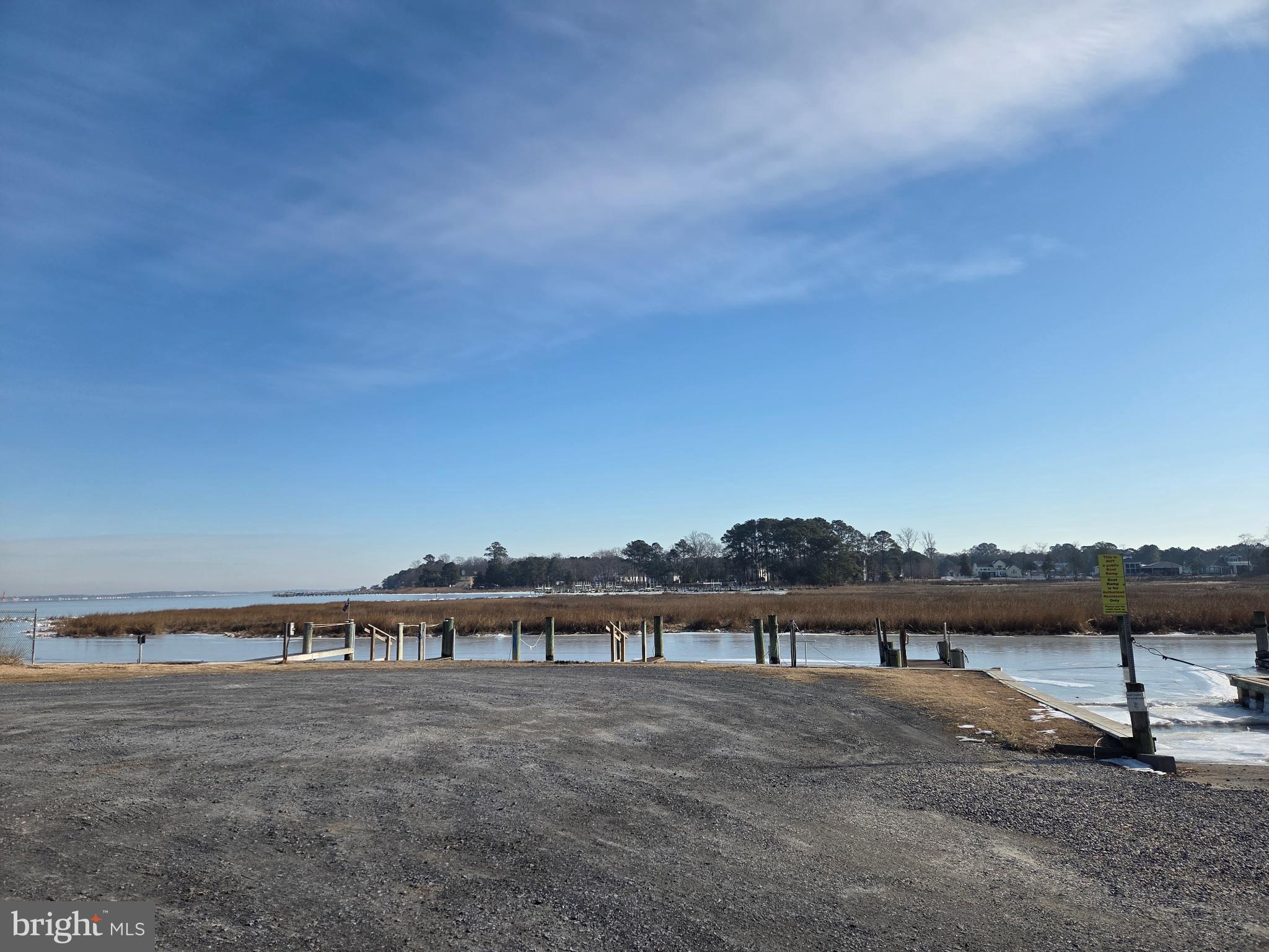 2 West Lagoon Road Dagsboro, DE 19939 - Photo 5 of 10 Serene waterfront with a tranquil dock.