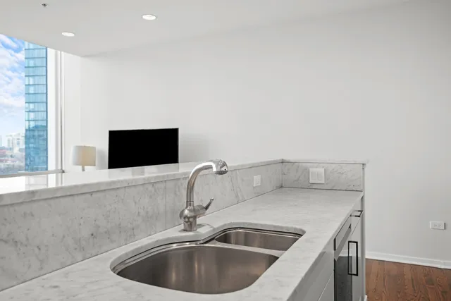 a kitchen with a sink and a microwave