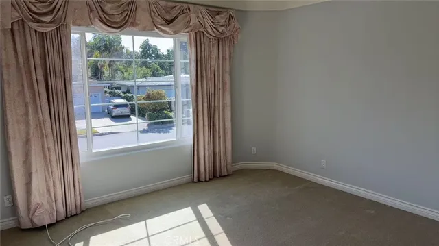 a view of a room that has a window and outside view