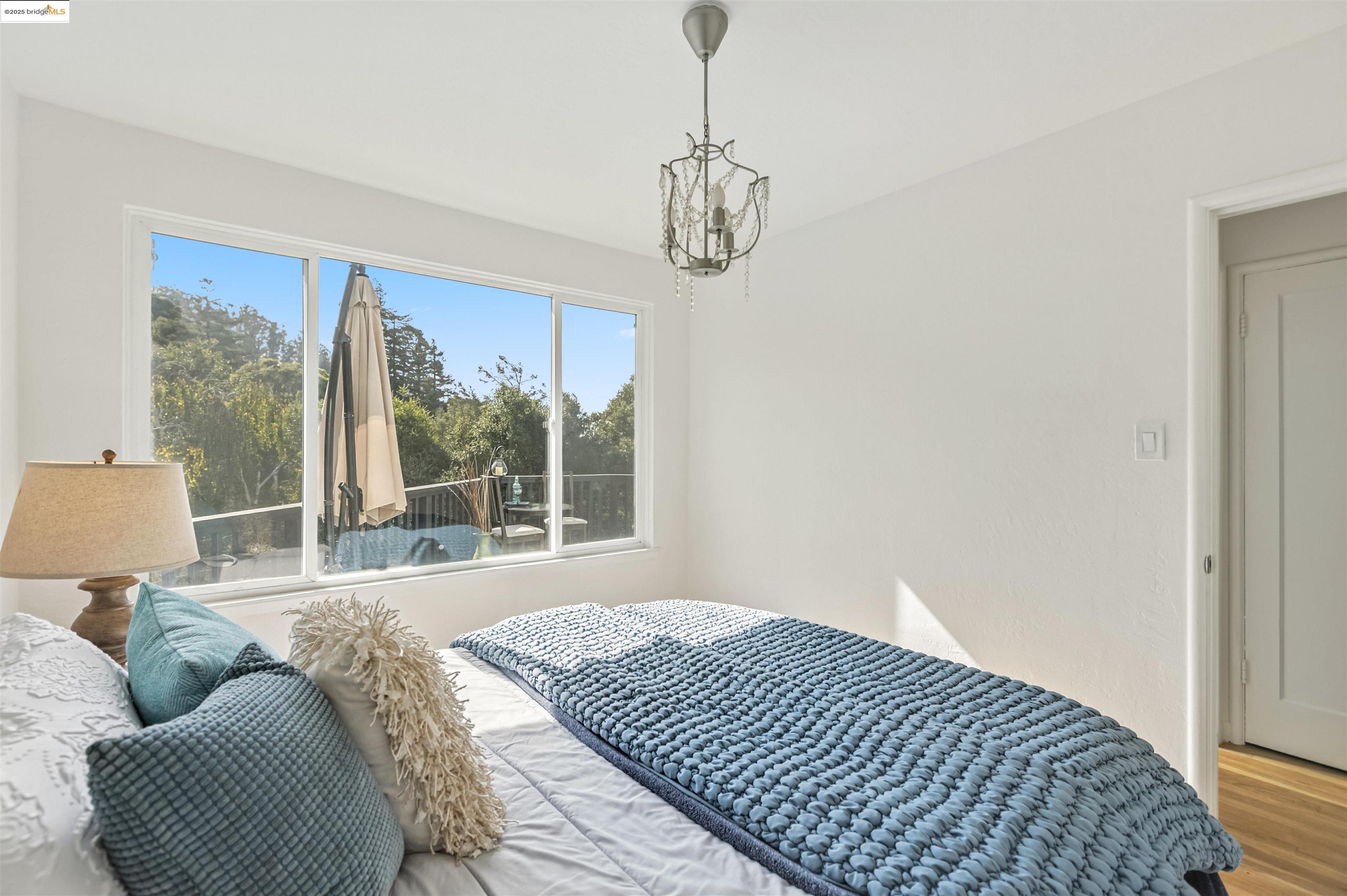 7318 Gladys Avenue El Cerrito, CA 94530 - Photo 19 of 33 a bedroom with a bed and window