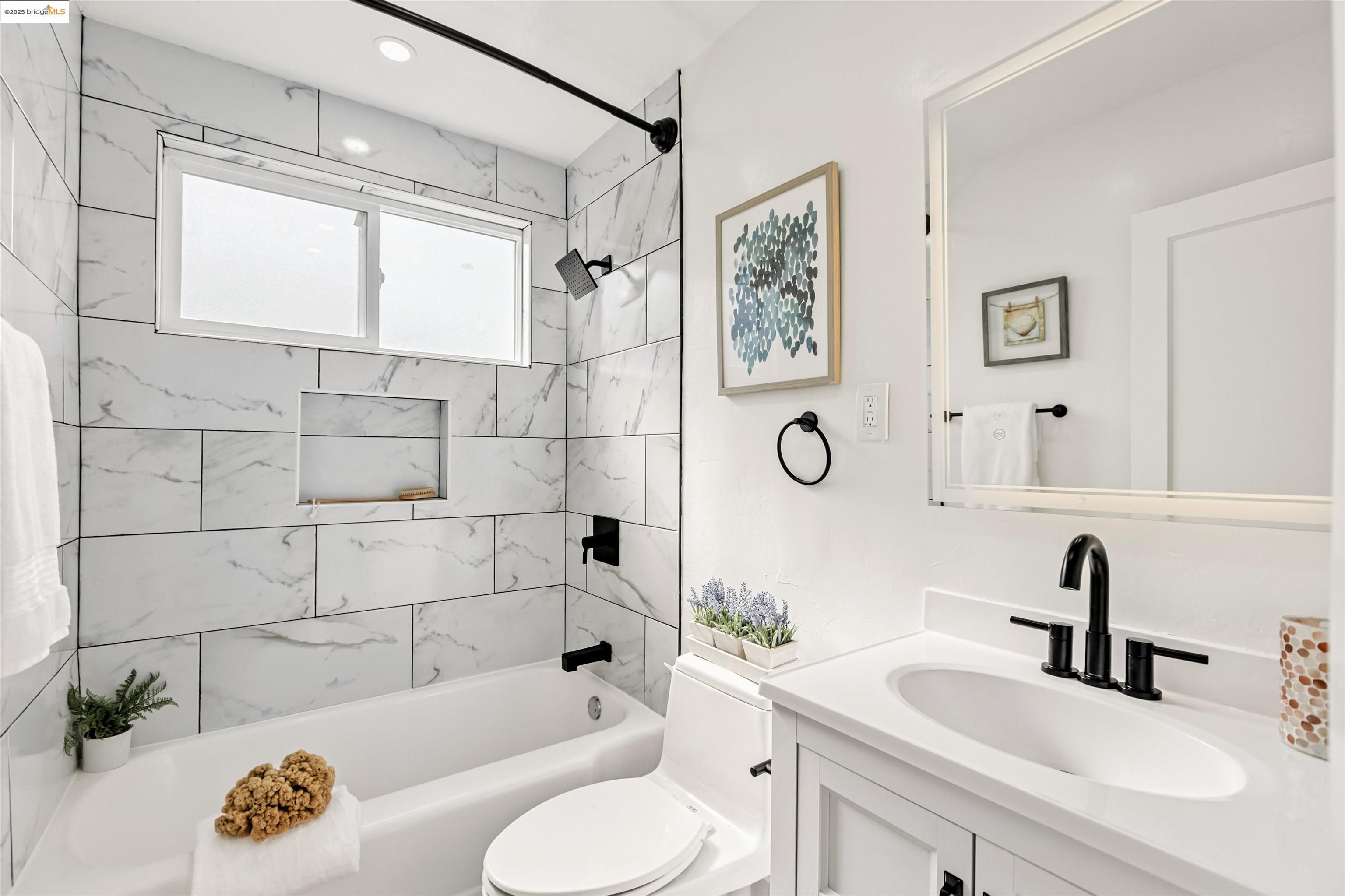 7318 Gladys Avenue El Cerrito, CA 94530 - Photo 20 of 33 a bathroom with a sink a toilet and shower