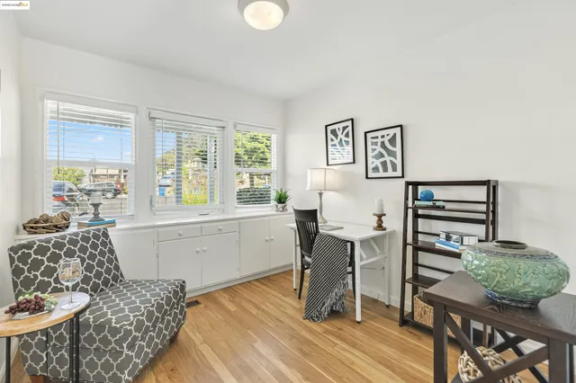 a bedroom with a bed and a table chair