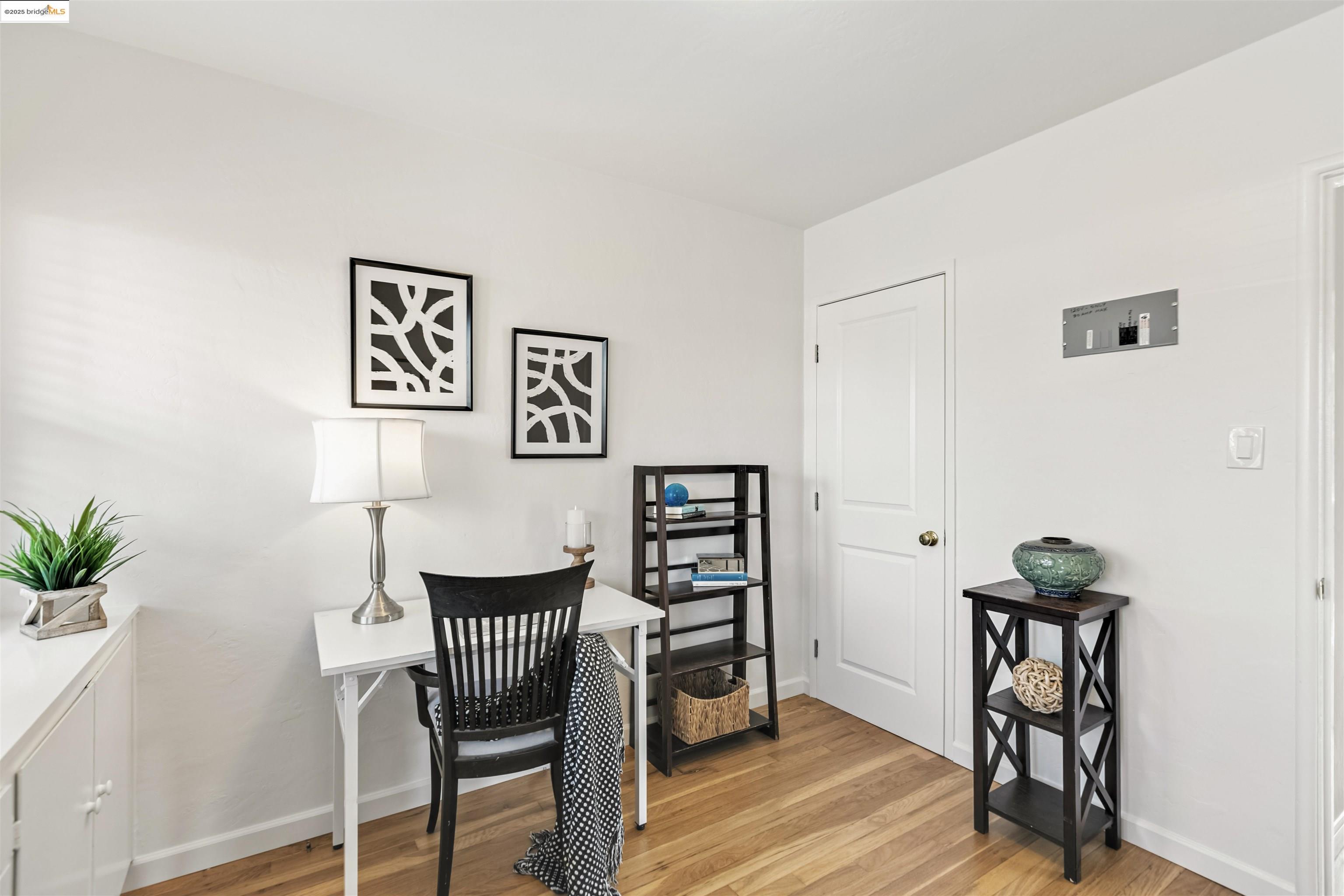 7318 Gladys Avenue El Cerrito, CA 94530 - Photo 24 of 33 a view of a workspace with furniture and wooden floor