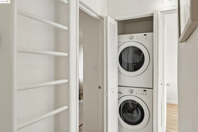 a view of a workspace with furniture and wooden floor