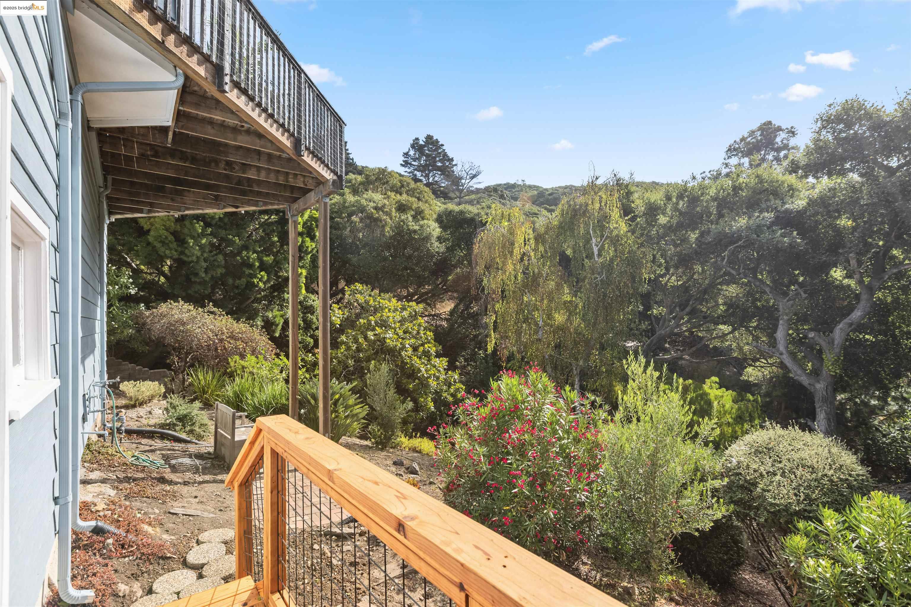 7318 Gladys Avenue El Cerrito, CA 94530 - Photo 26 of 33 a view of balcony with a couple of cars parked on road in front of house