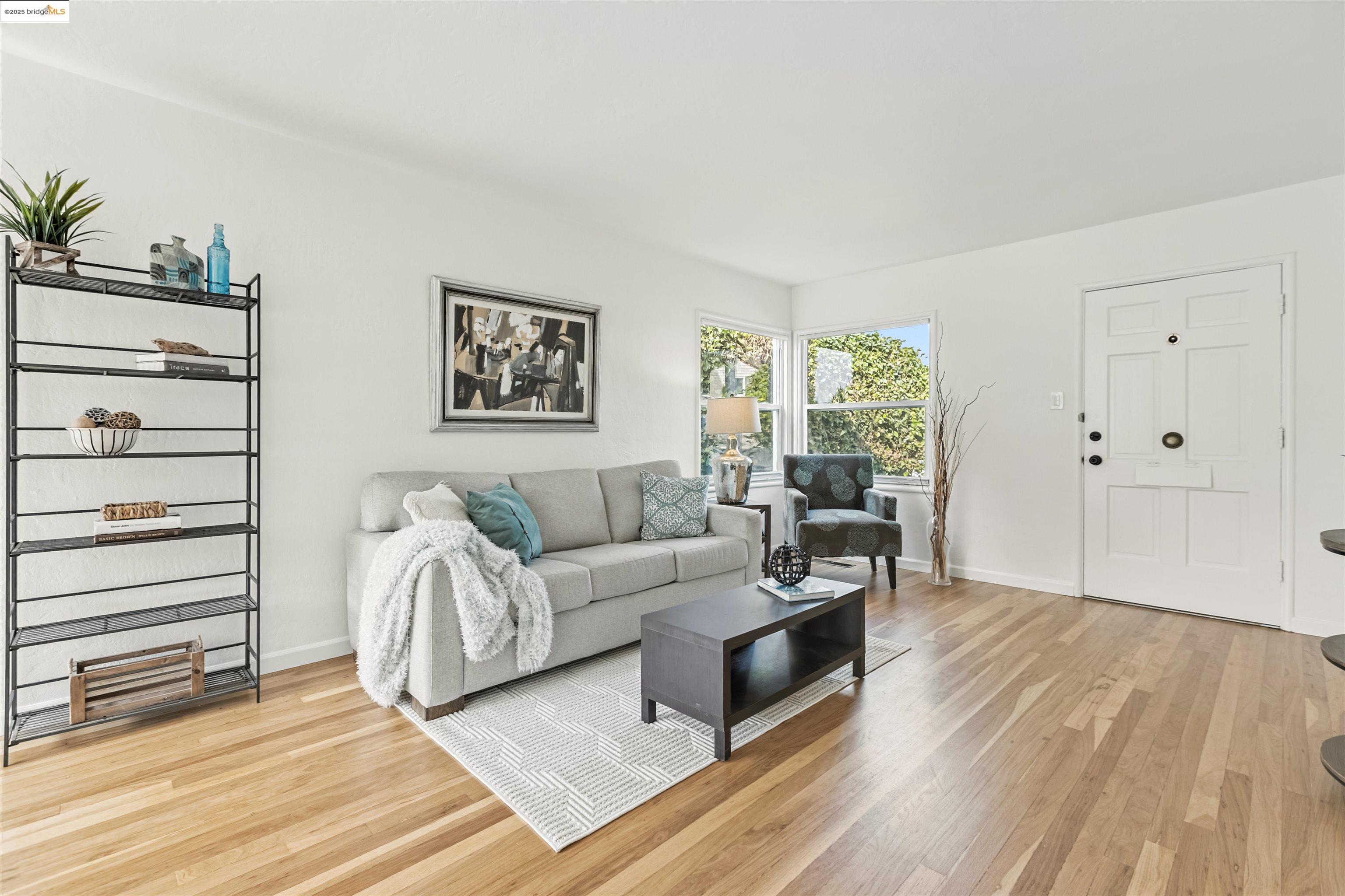 7318 Gladys Avenue El Cerrito, CA 94530 - Photo 5 of 33 a living room with furniture and a wooden floor