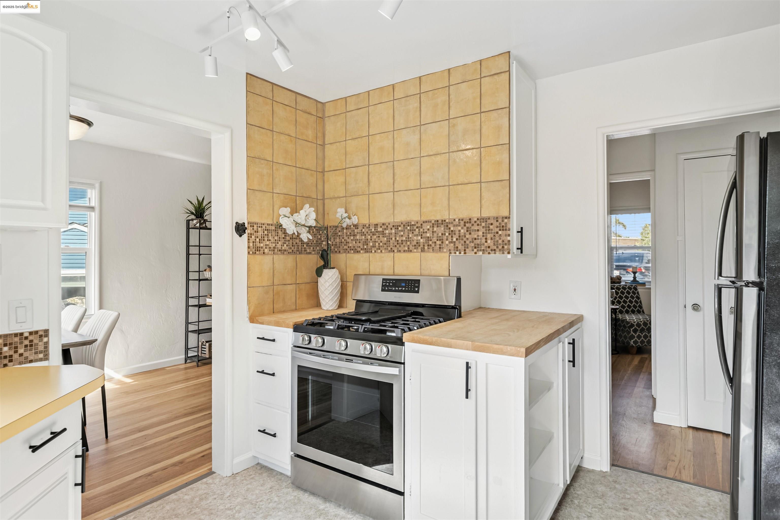 7318 Gladys Avenue El Cerrito, CA 94530 - Photo 10 of 33 a kitchen with a stove and a refrigerator