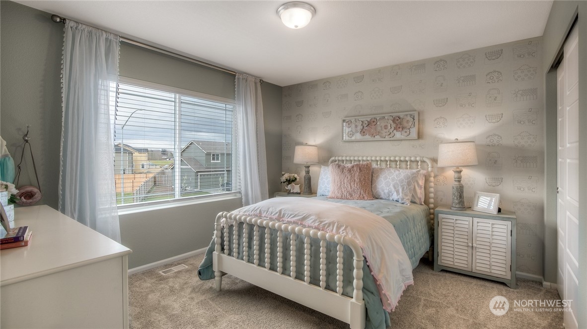 1323 Baker Hts Loop Bremerton, WA 98312 - Photo 12 of 18 a bedroom with a bed and a window