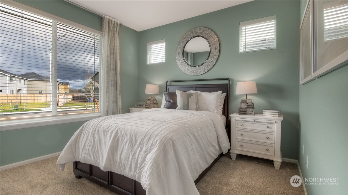 1323 Baker Hts Loop Bremerton, WA 98312 - Photo 13 of 18 a bedroom with a bed and a window