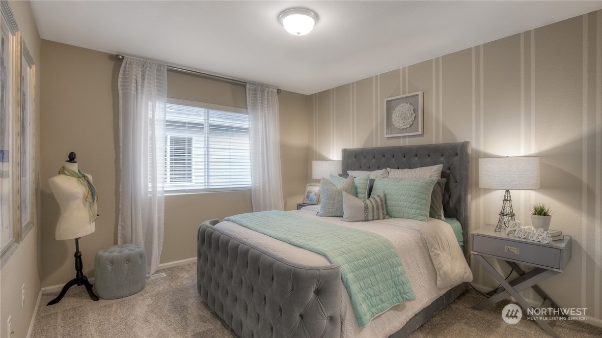 1323 Baker Hts Loop Bremerton, WA 98312 - Photo 15 of 18 a bedroom with a bed and a lamp