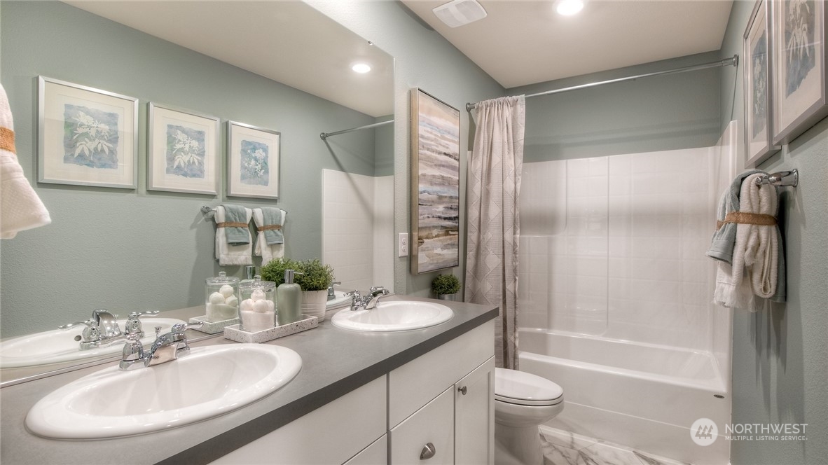 1323 Baker Hts Loop Bremerton, WA 98312 - Photo 16 of 18 a bathroom with a granite countertop sink toilet and shower