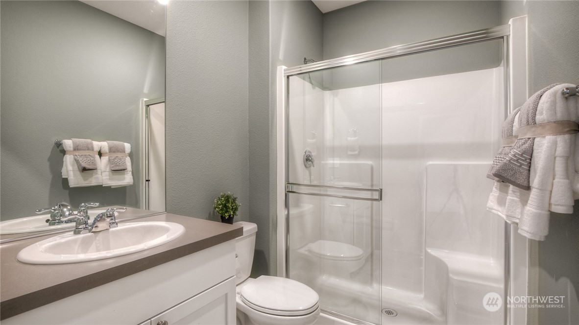 1323 Baker Hts Loop Bremerton, WA 98312 - Photo 17 of 18 a bathroom with a sink toilet and shower